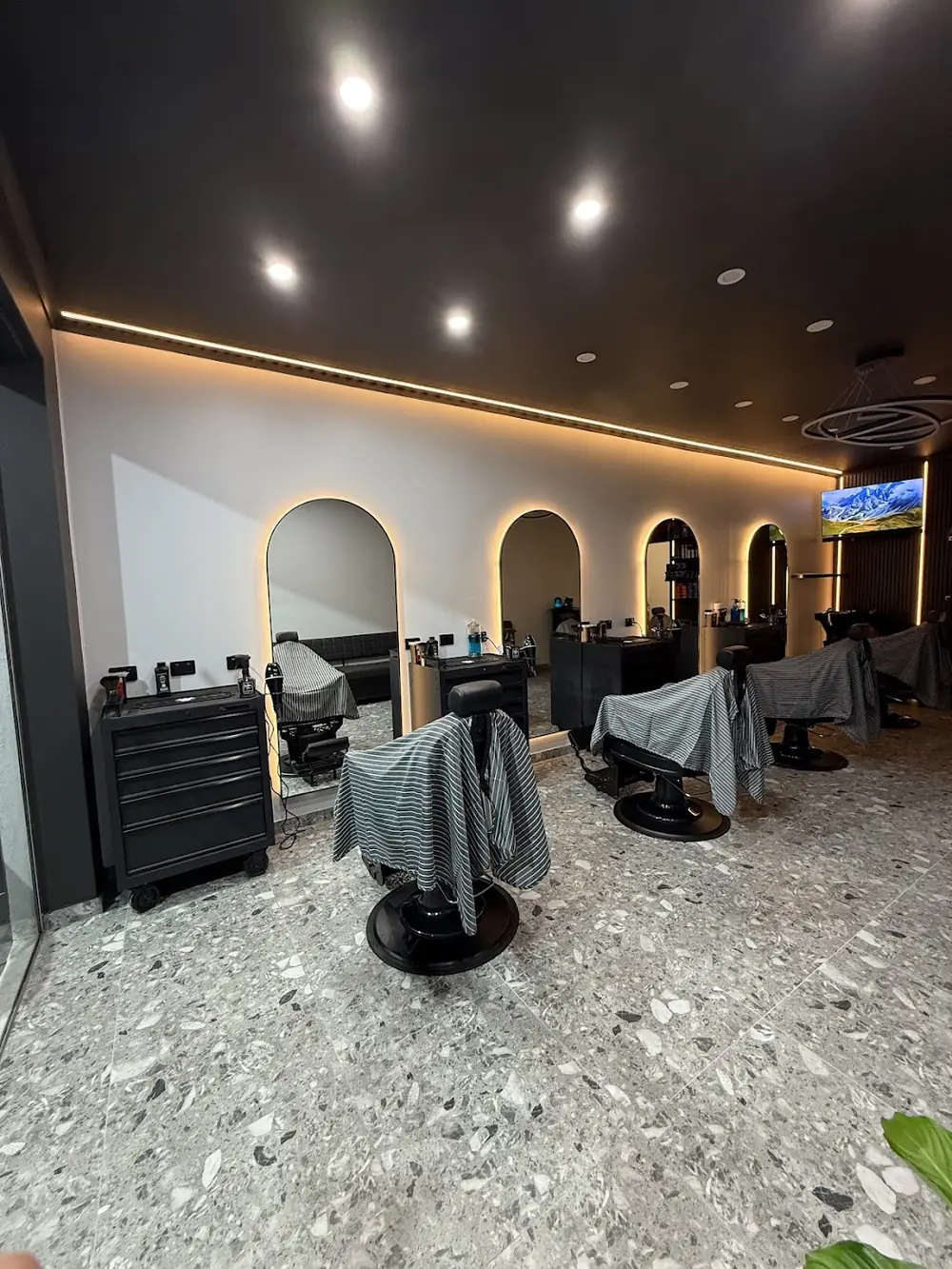 The chairs and mirrors inside Blends & Blades
